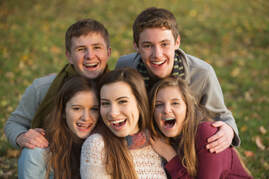 Group of smiling friends including individuals with braces